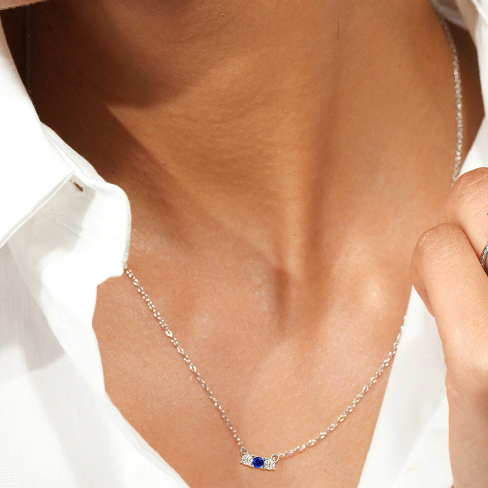 Model Wearing Sapphire and Diamond Dainty Three Stone Necklace view