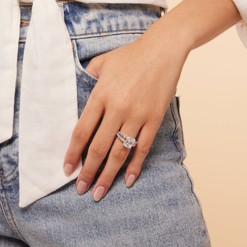Model Wearing Luxe Emerald Step Side Stone Classic Engagement Ring view