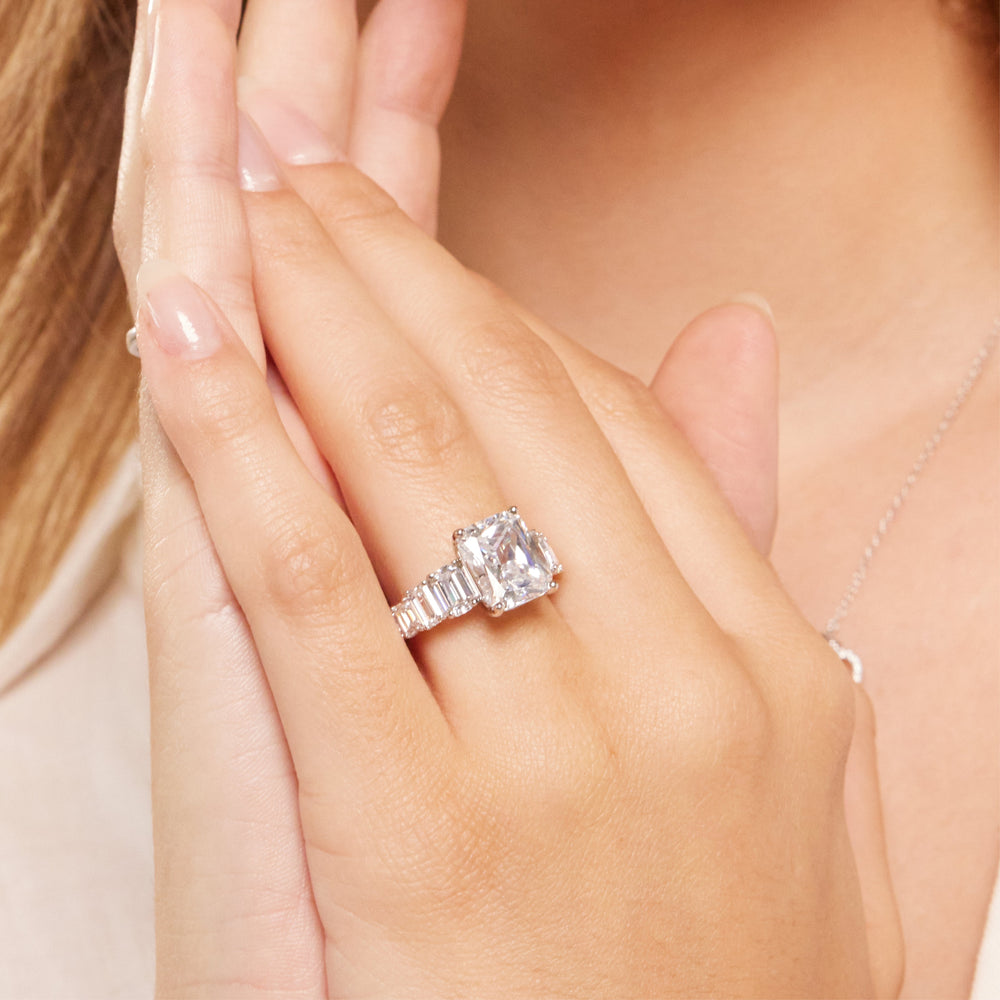 Model Wearing Luxe Emerald Step Side Stone Classic Engagement Ring view