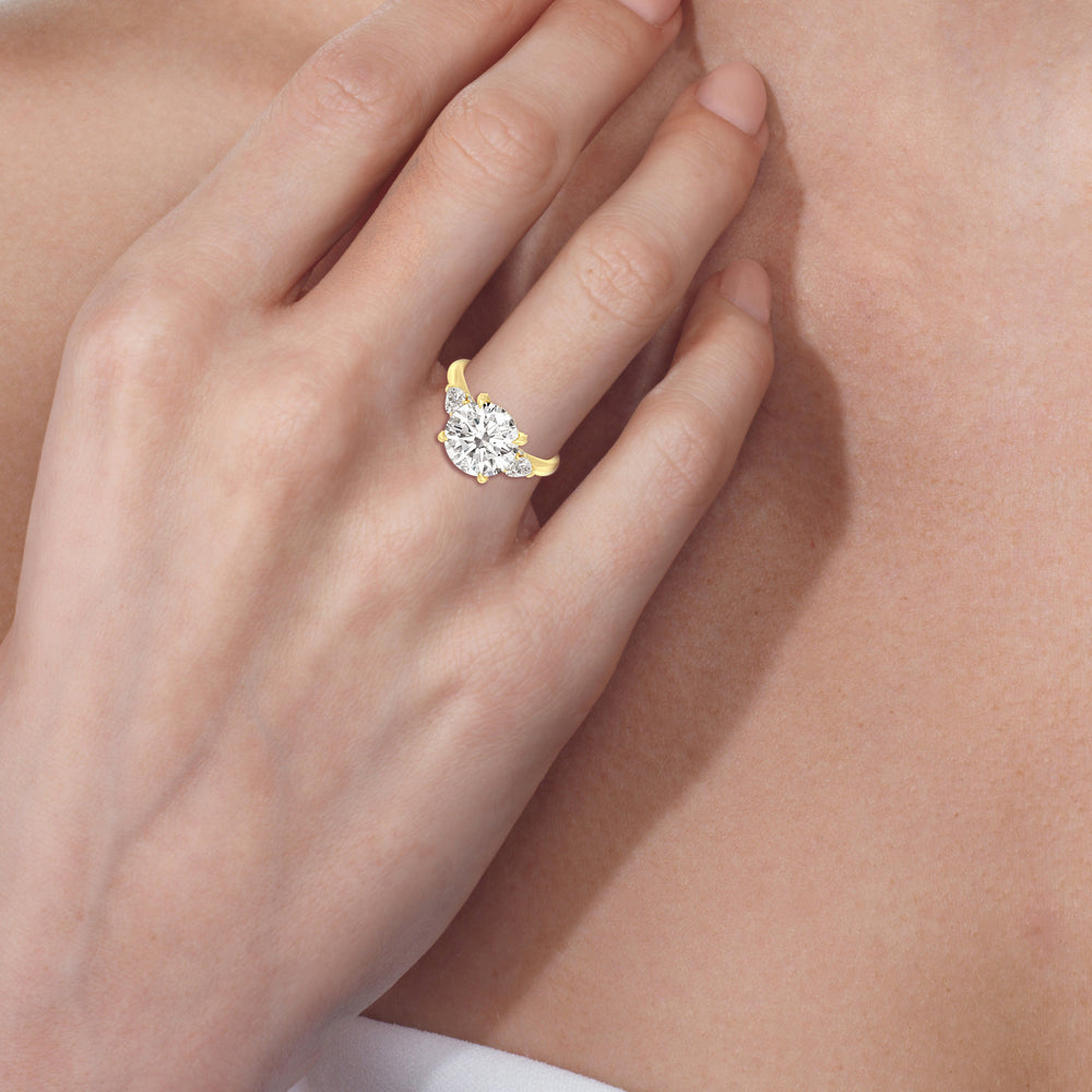 Model Wearing Elegance Pear Side Stone Engagement Ring view
