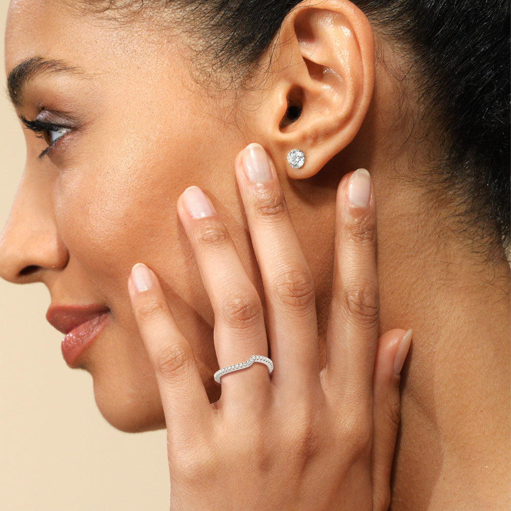 Model Wearing Ascending Gallery Studded Hidden Halo Diamond Wedding Band view