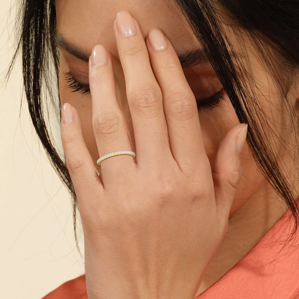 Model Wearing Fine Modern Fine Line Hidden Halo Diamond Wedding Band view