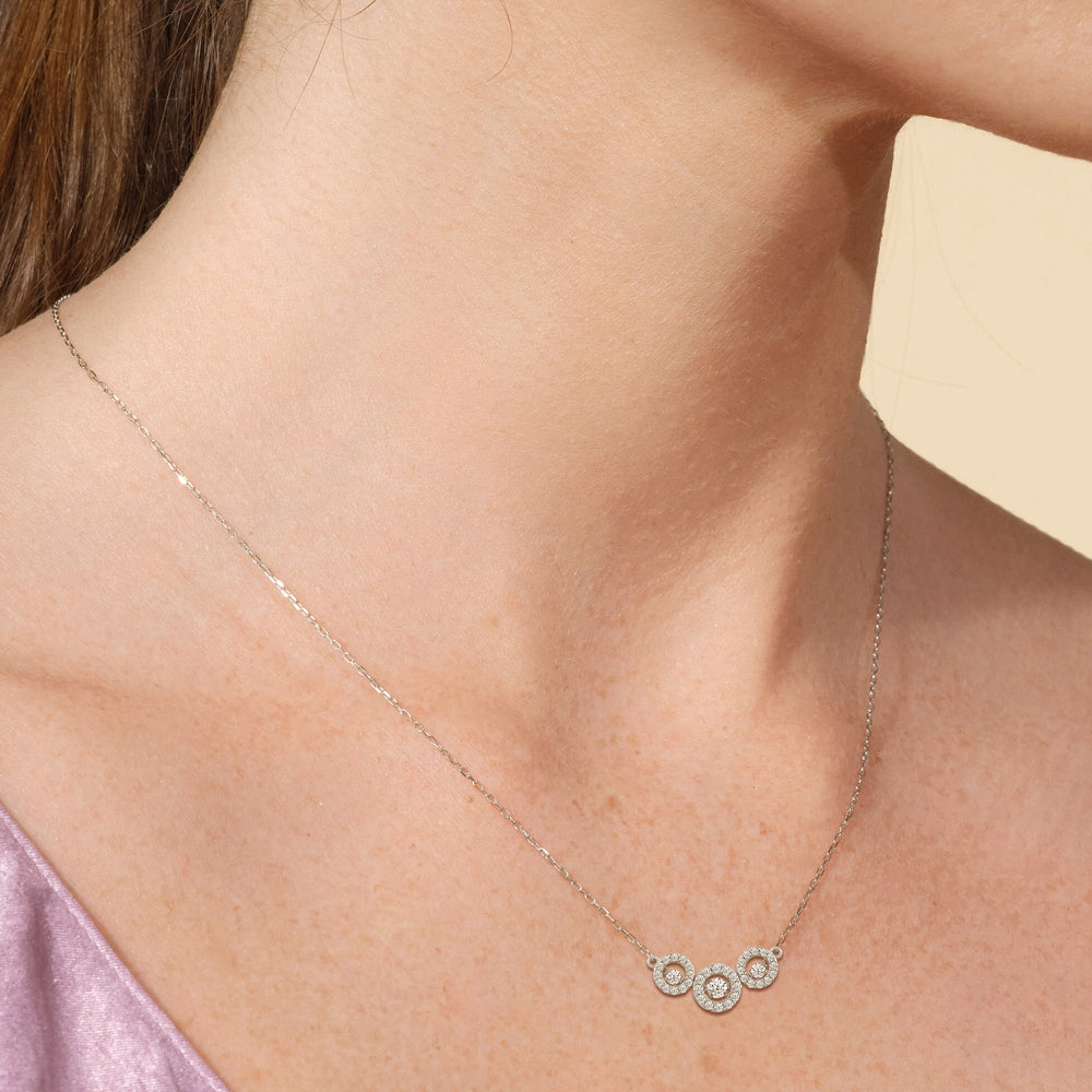 Model Wearing Dancing Diamonds Three Stone Halo Necklace view