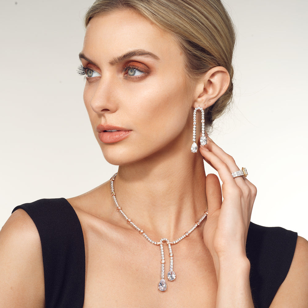 Model Wearing Balanced Oval and Pear Dangler Tennis Necklace view