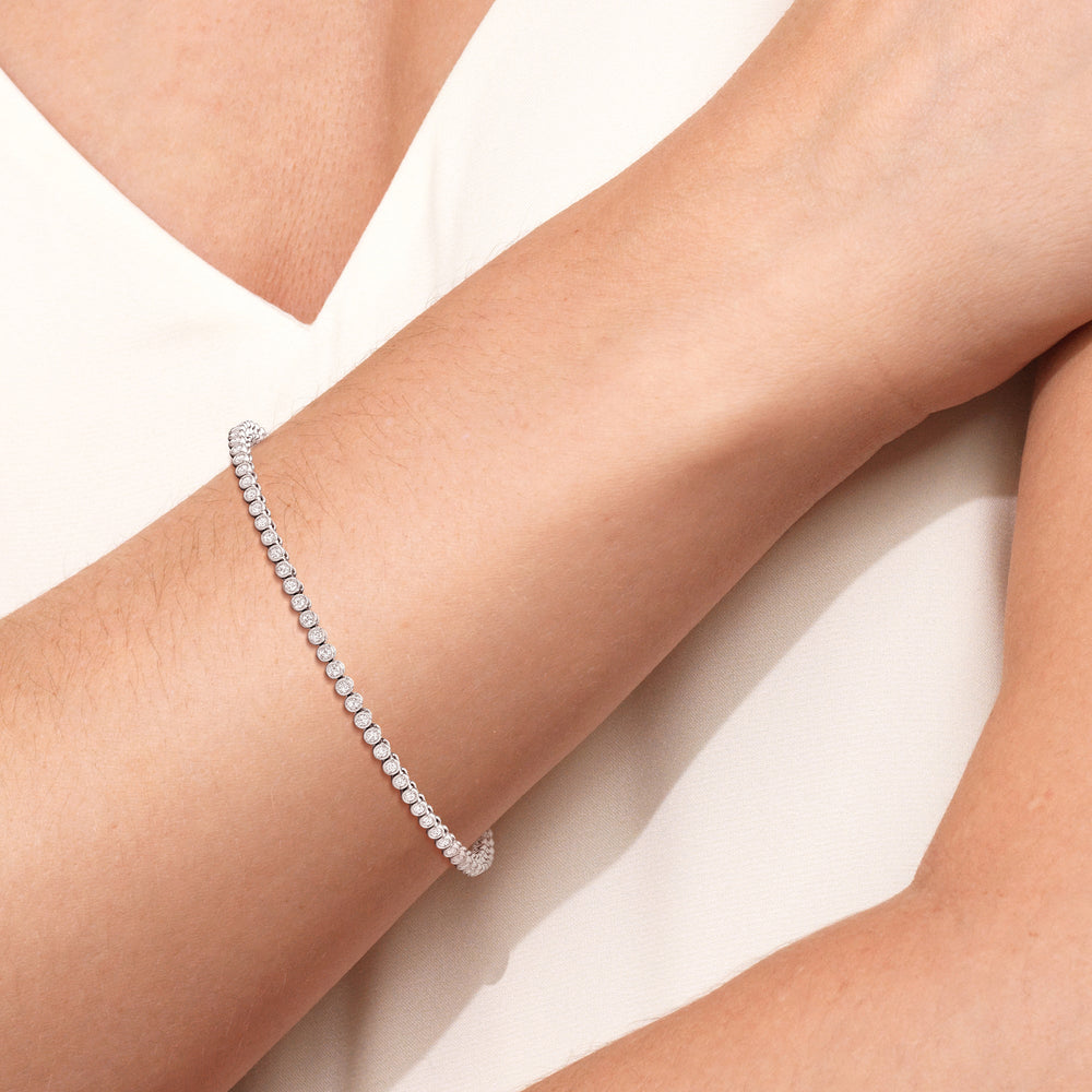 Bezel Set Round Lab Diamond Tennis Bracelet with 1 Cut Diamond in 14KT Rose Gold view 4
