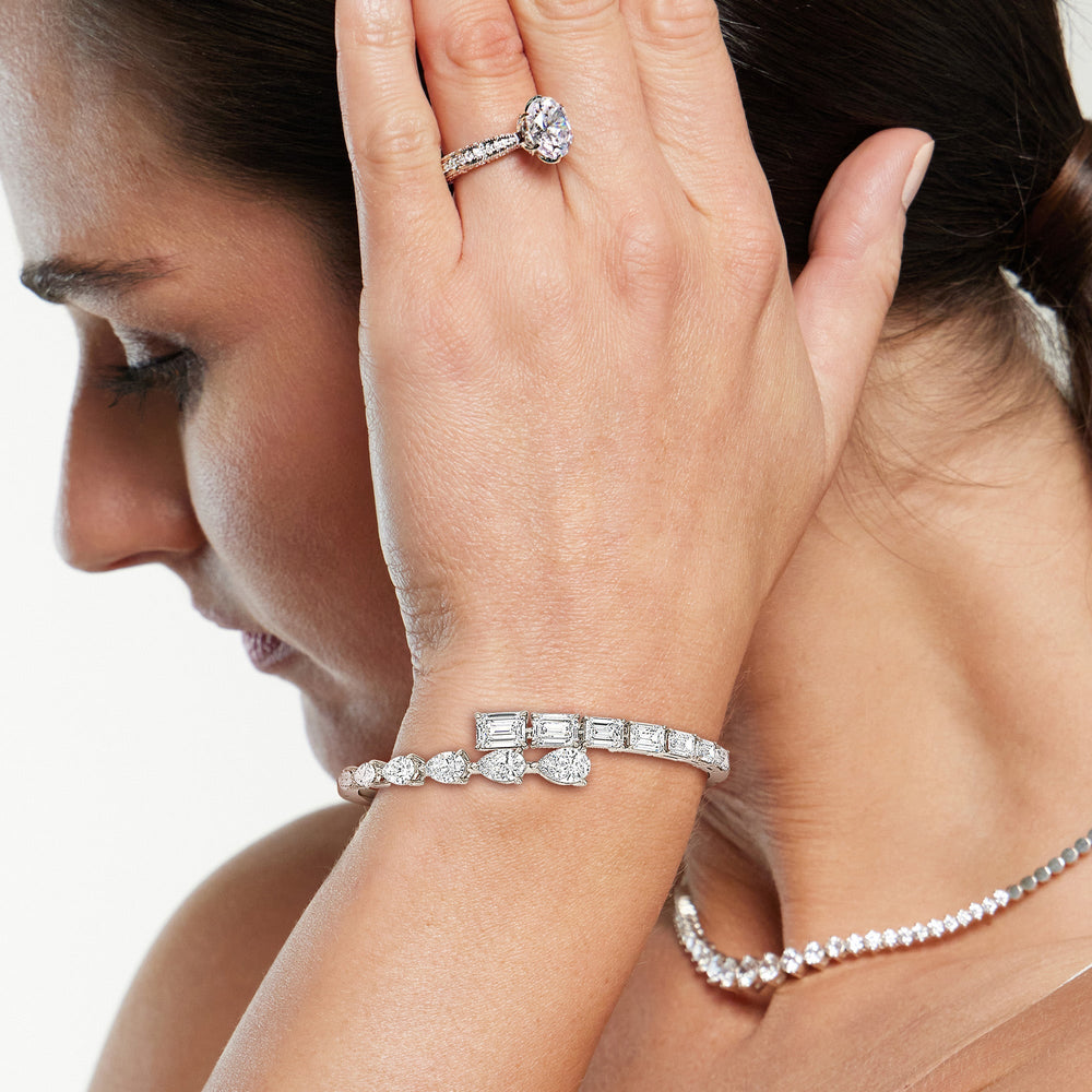 Model Wearing Graduating Emerald And Pear Bangle view