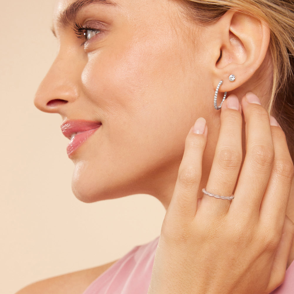 Model Wearing Modern East West Hidden Halo Solitaire Wedding Band view