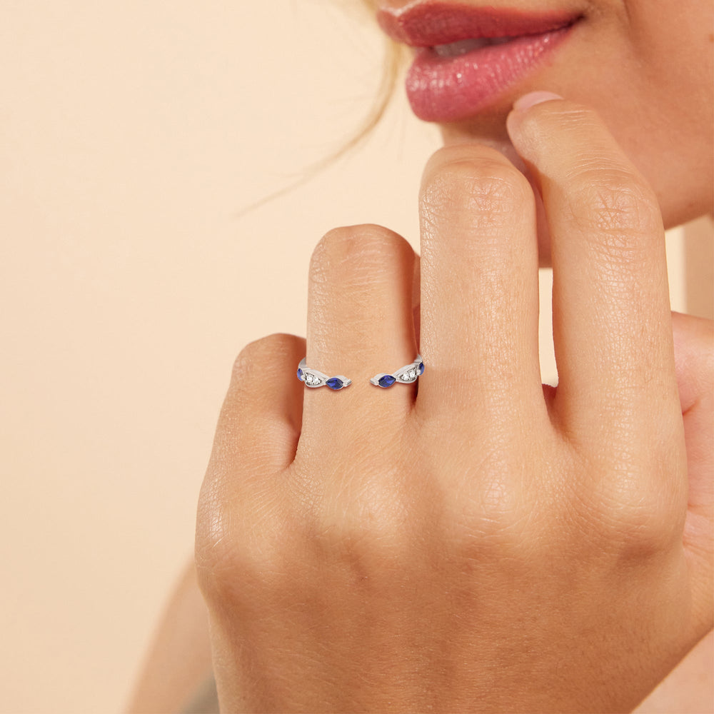 Model Wearing Something Blue Gerbera Marquise Created Blue Sapphire and Diamond Wedding Band view
