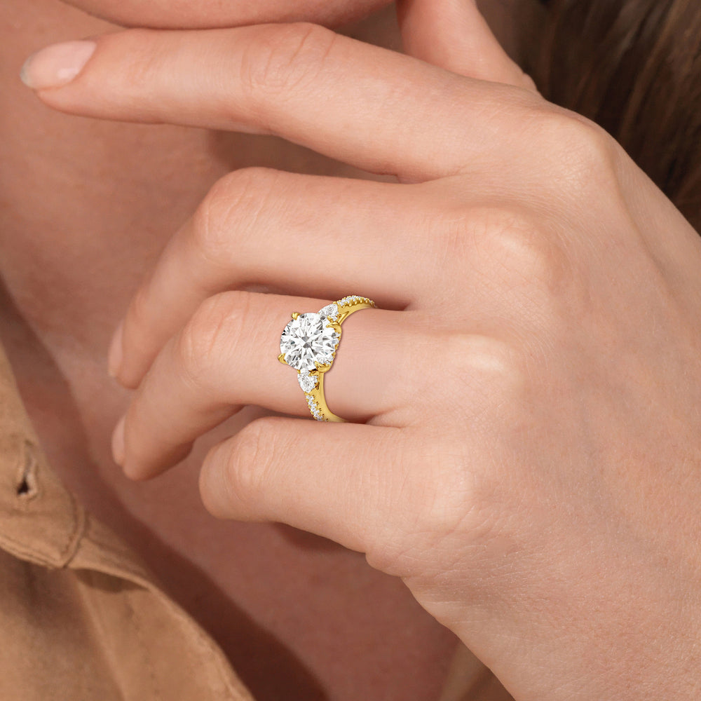 Model Wearing The Atrium Pear Three Stone Engagement Ring view