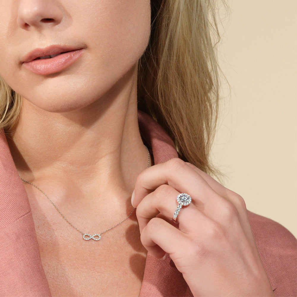 Model Wearing Broad Halo Cathedral Engagement Ring view