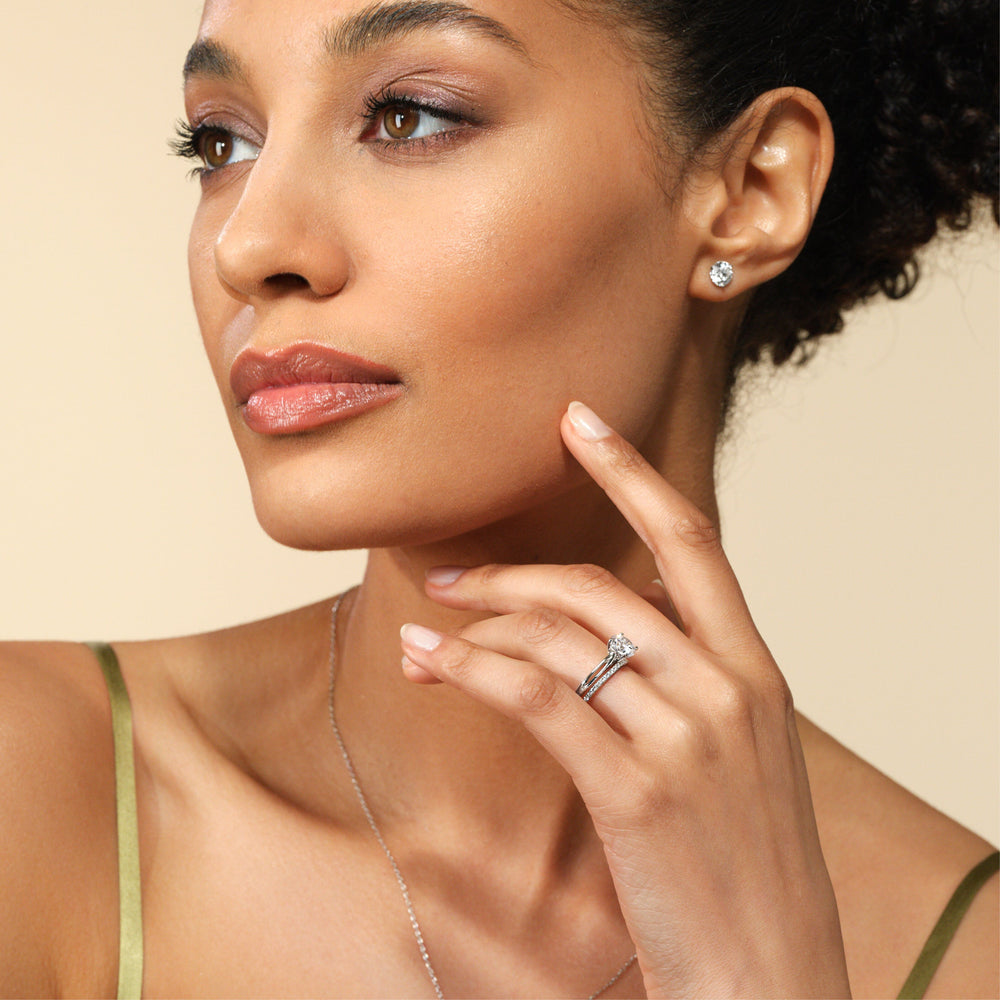 Model Wearing Delicate Pinched Cathedral Solitaire Diamond Wedding Band view