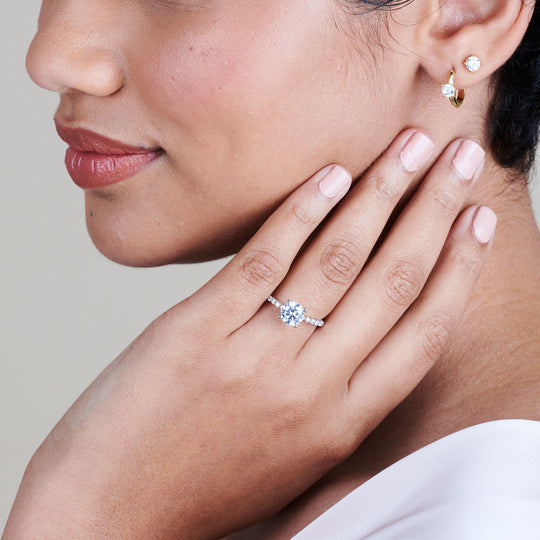 Model Wearing 2 3/4 cttw Oval Cut Under Bezeled Accent Diamond Engagement Ring view