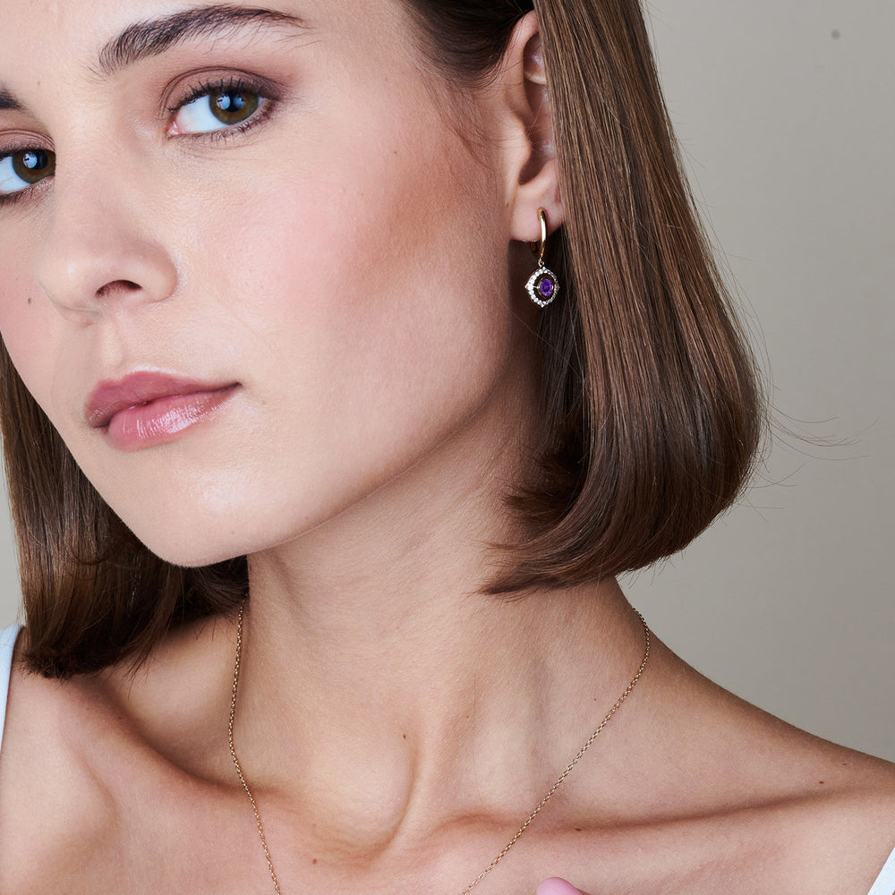 Model Wearing Signature Amethyst Birthstone Drop Huggies view