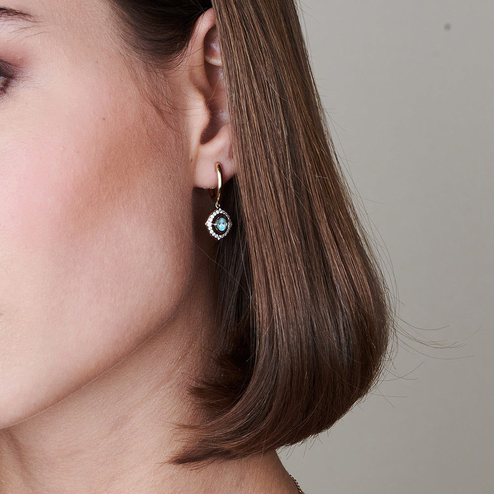 Model Wearing Signature Aquamarine Birthstone Drop Huggies view