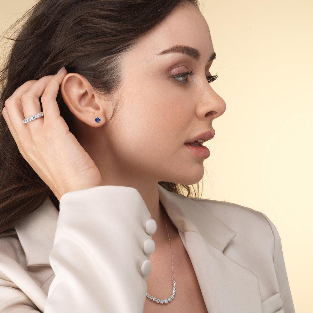 Model Wearing Round Sapphire and Lab Diamond Classic Solitaire Under-Halo Earrings view