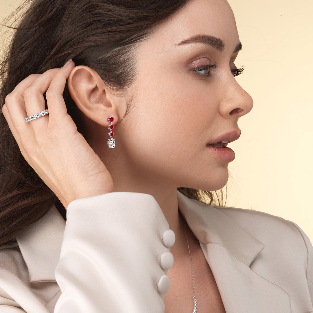 Model Wearing Elegance Oval Diamond And Created Ruby Dangler Earrings view