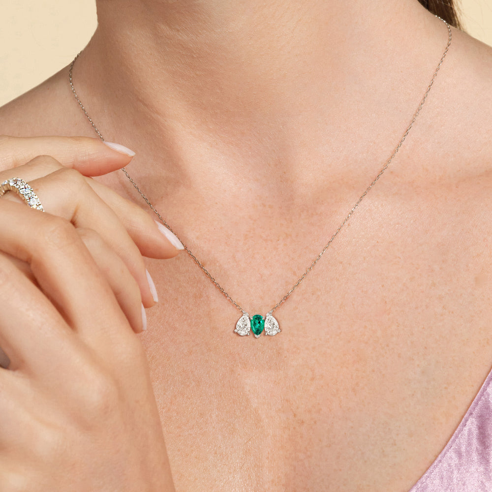 Model Wearing Emerald And Diamond Trio Pear Cluster Necklace view