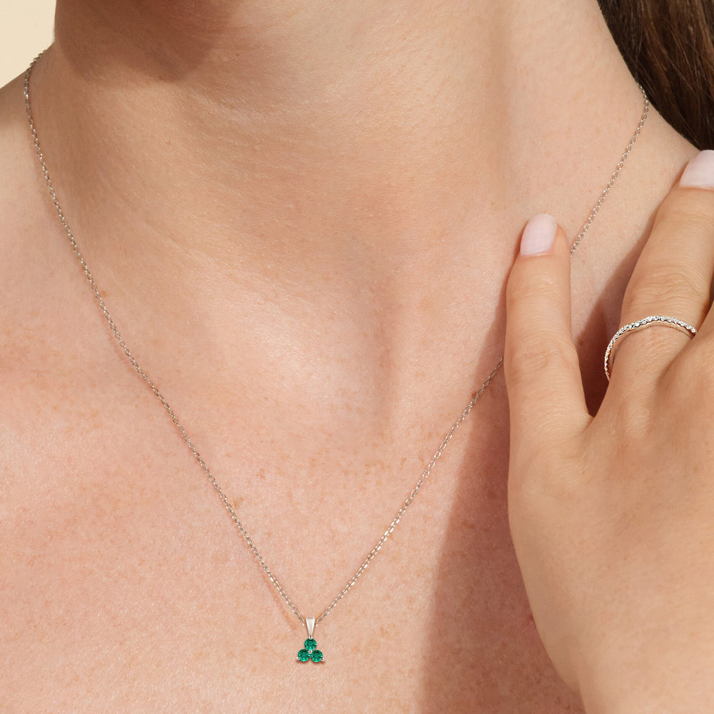 Model Wearing Emerald Three Stone Cluster PendantTest Drashya view