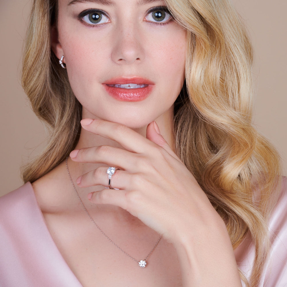 Model Wearing Fine Line Pear Three Stone Engagement Ring with Lab Grown Diamond view
