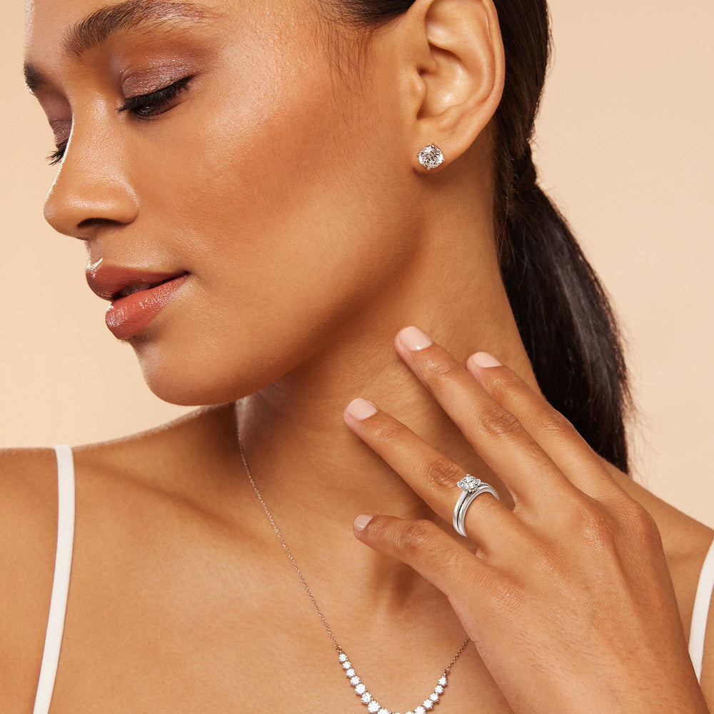 Model Wearing Aura Studded Crescent Shank Hidden Halo Solitaire Wedding Band view