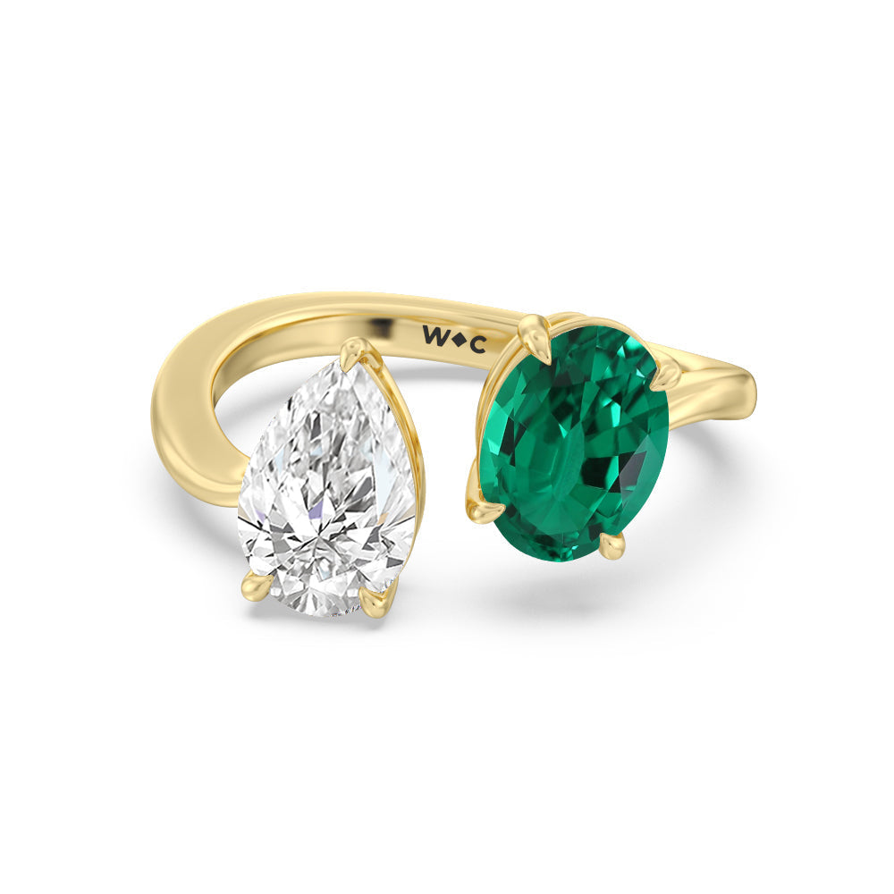 Toi Et Moi Created Emerald Oval and Pear Diamond Curved Engagement Ring with 14KT Yellow Gold Cut Diamond in 14KT Yellow Gold view 1
