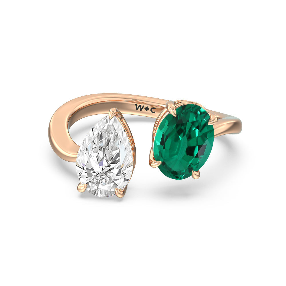 Toi Et Moi Created Emerald Oval and Pear Diamond Curved Engagement Ring with 14KT Rose Gold Cut Diamond in 14KT Rose Gold view 1

