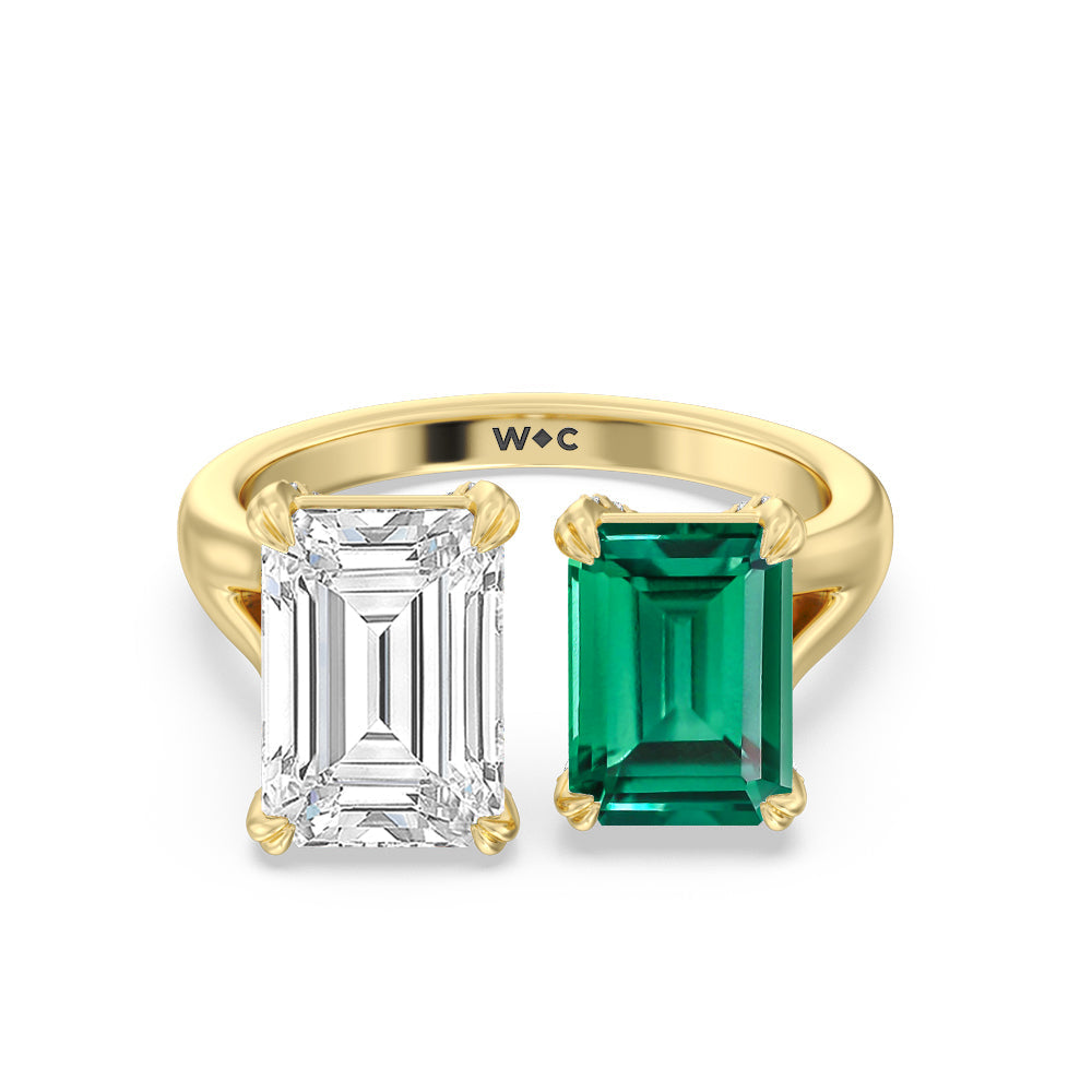 Toi Et Moi Created Emerald and Emerald Shape Diamond Studded Basket Engagement Ring with 14KT Yellow Gold Cut Diamond in 14KT Yellow Gold view 1
