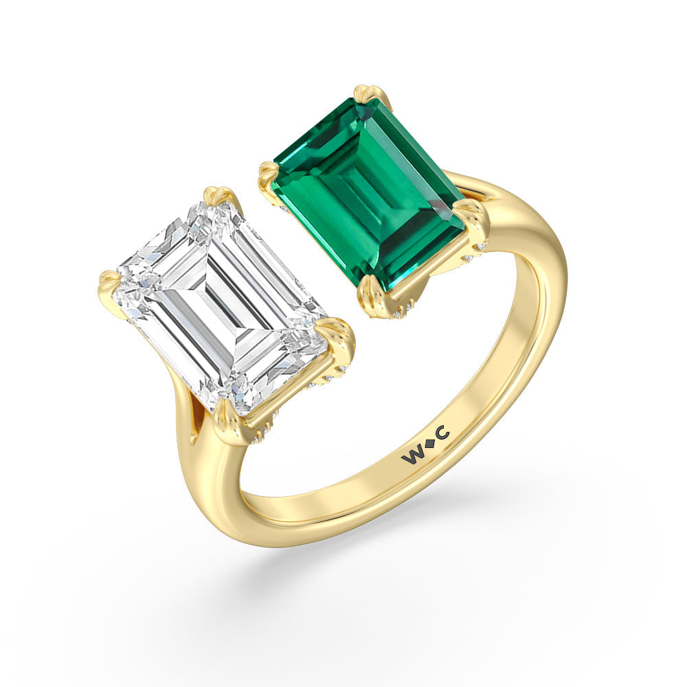 Toi Et Moi Created Emerald and Emerald Shape Diamond Studded Basket Engagement Ring with 14KT Yellow Gold Cut Diamond in 14KT Yellow Gold view 2

