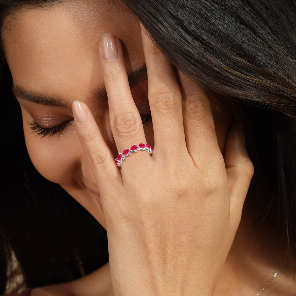 Model Wearing Trailing Created Ruby Pear Anniversary Ring view