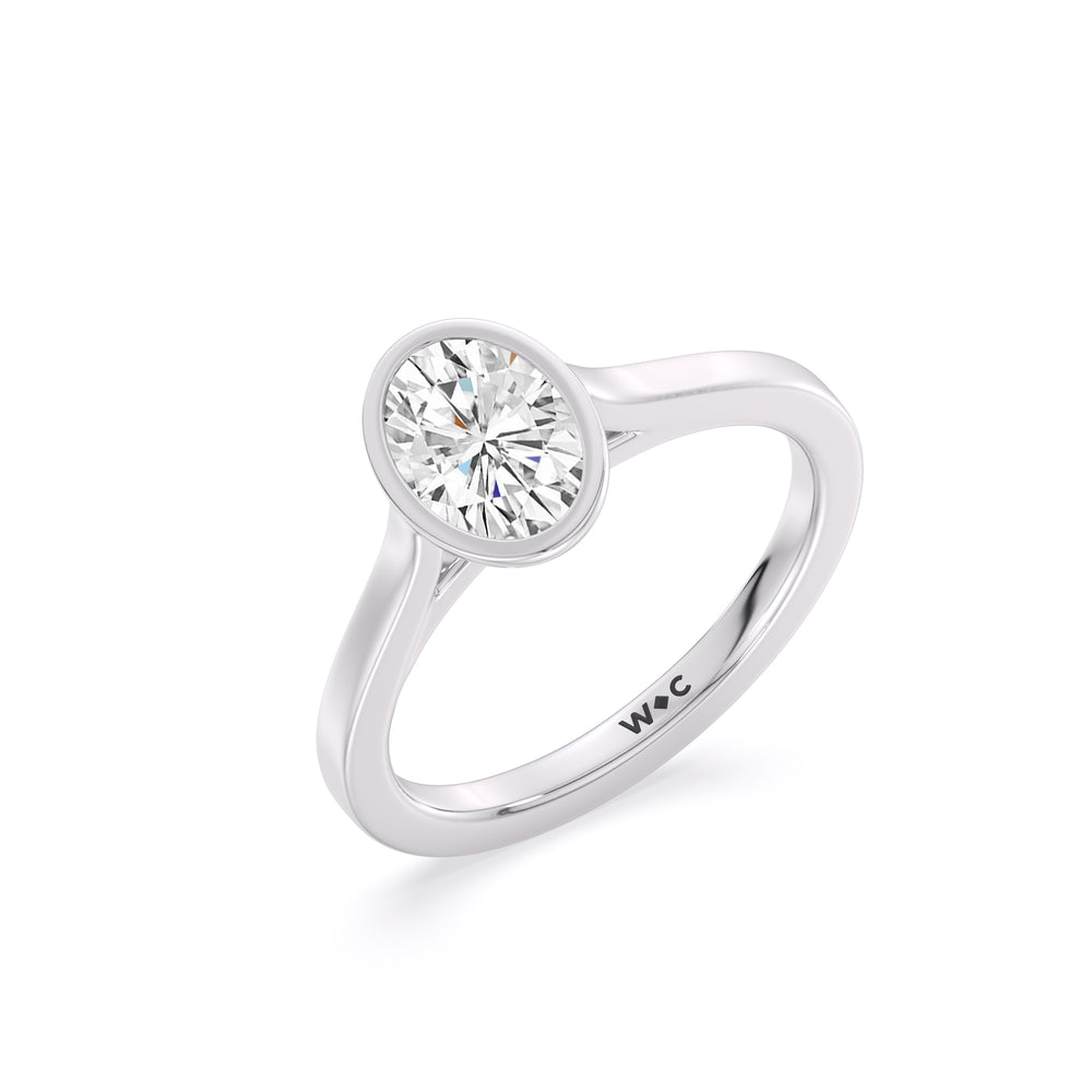 Fine Bezel Solitaire Engagement Ring with Oval Cut Diamond in 14KT Platinum view 3
