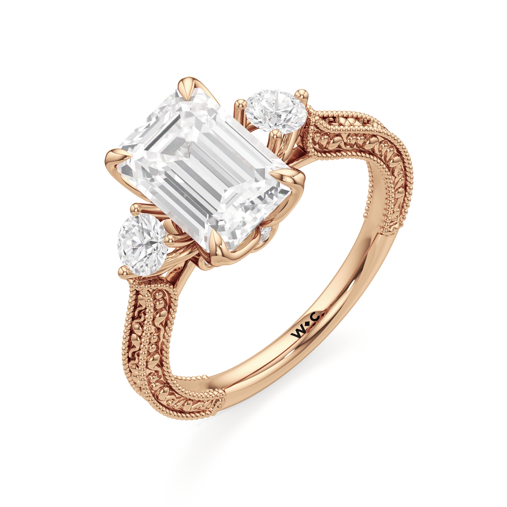 The Seraphine Round Three Stone Ring with Emerald Cut Diamond in 14KT Rose Gold view 6
