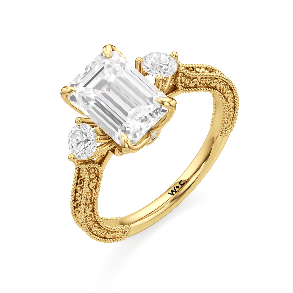 The Seraphine Round Three Stone Ring with Emerald Cut Diamond in 14KT Yellow Gold view 6
