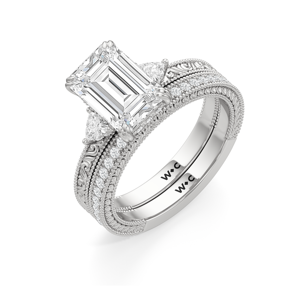 The Seraphine Trillion Three Stone Ring with Emerald Cut Diamond in 14KT Platinum view 8
