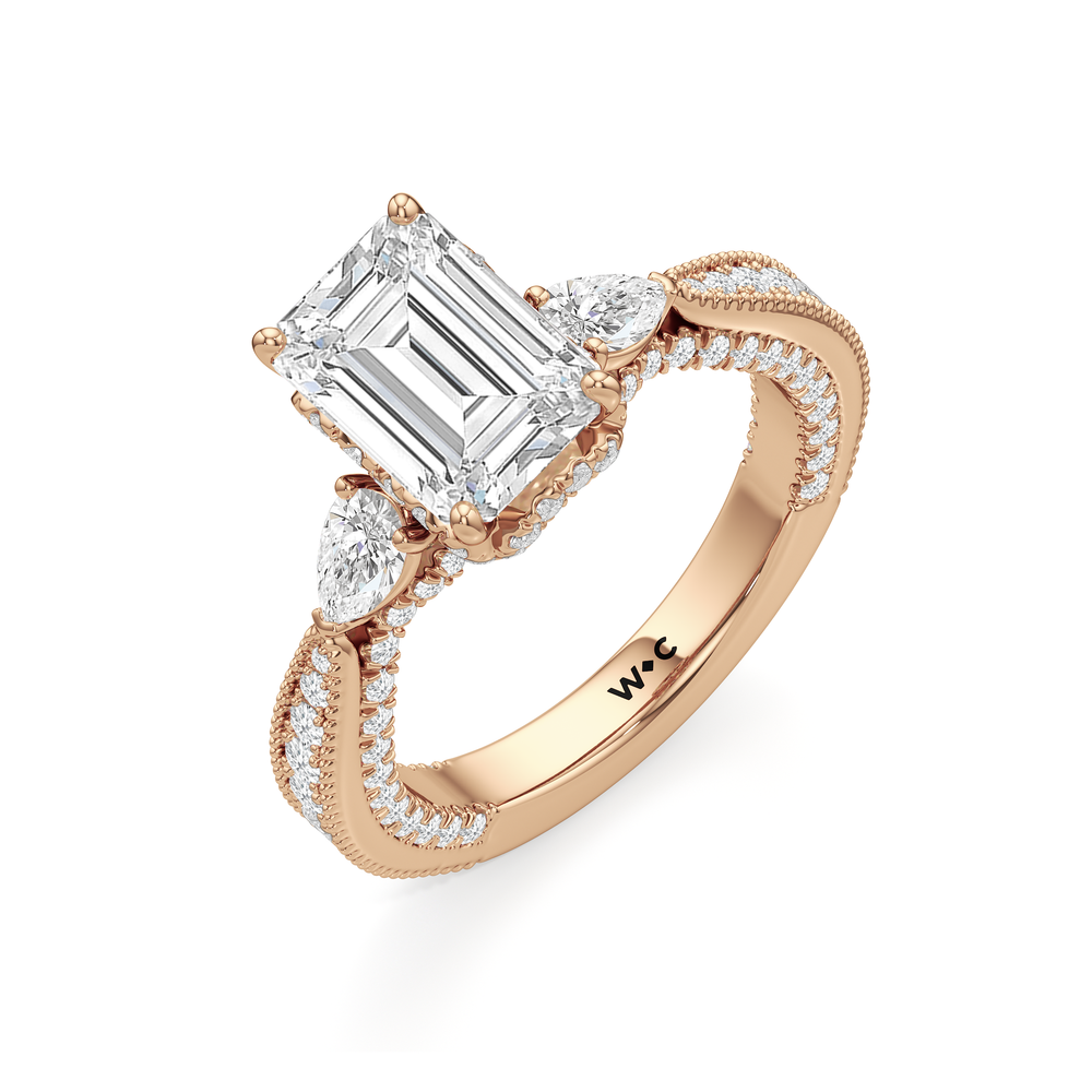 The Chrysler Pear Three Stone Ring with Emerald Cut Diamond in 14KT Rose Gold view 3
