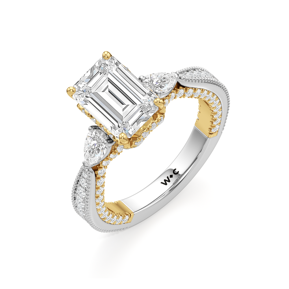 The Chrysler Pear Three Stone Ring with Emerald Cut Diamond in 14KT White & Yellow Gold view 3
