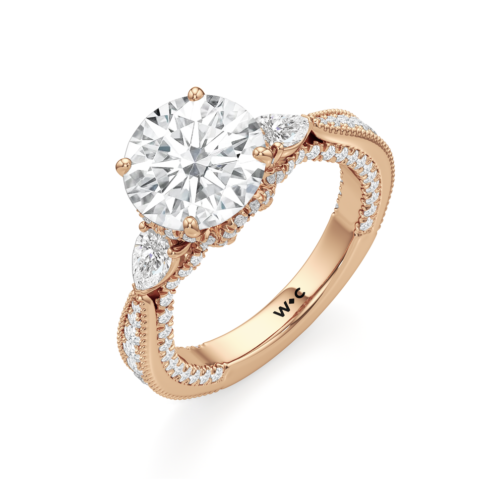 The Chrysler Pear Three Stone Ring with Round Cut Diamond in 14KT Rose Gold view 2
