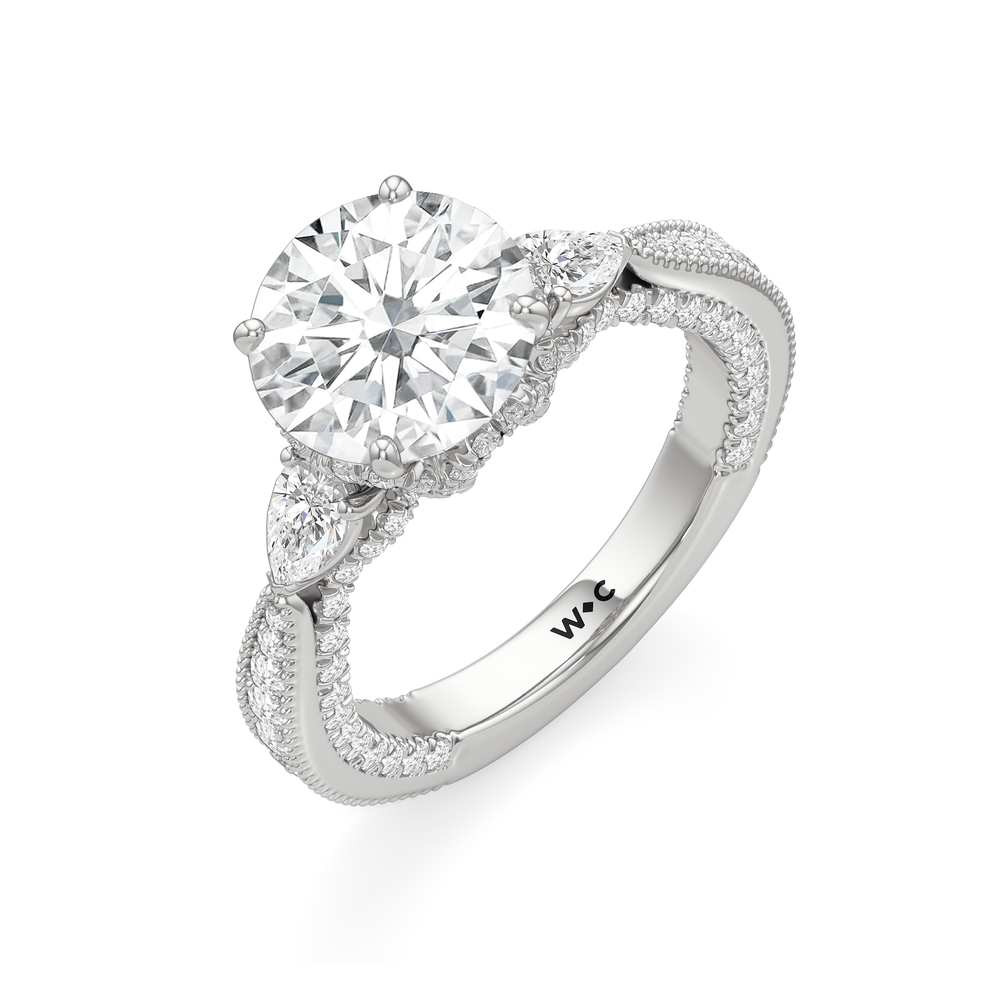 The Chrysler Pear Three Stone Ring with Round Cut Diamond in 14KT Platinum view 6
