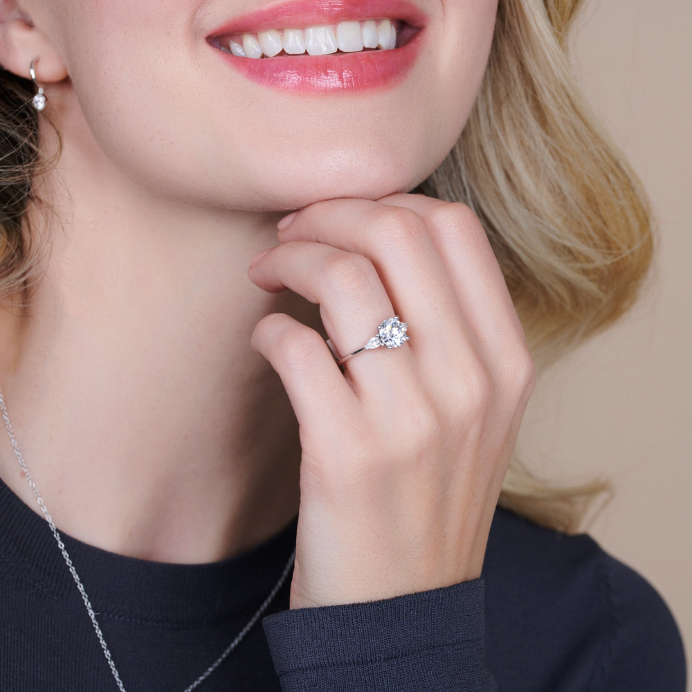 Model Wearing Three Stone Pear Engagement Ring view