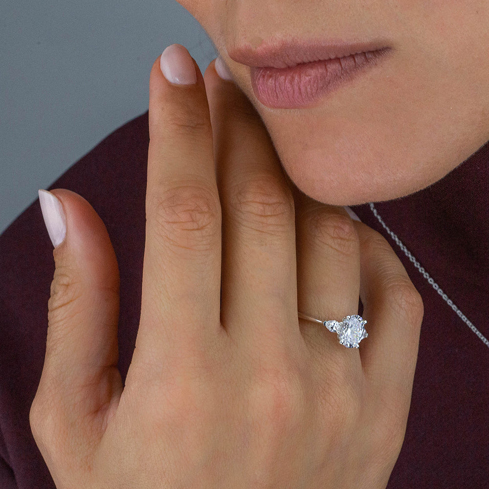 Model Wearing Three Stone Pear Engagement Ring with Lab Grown Diamond view