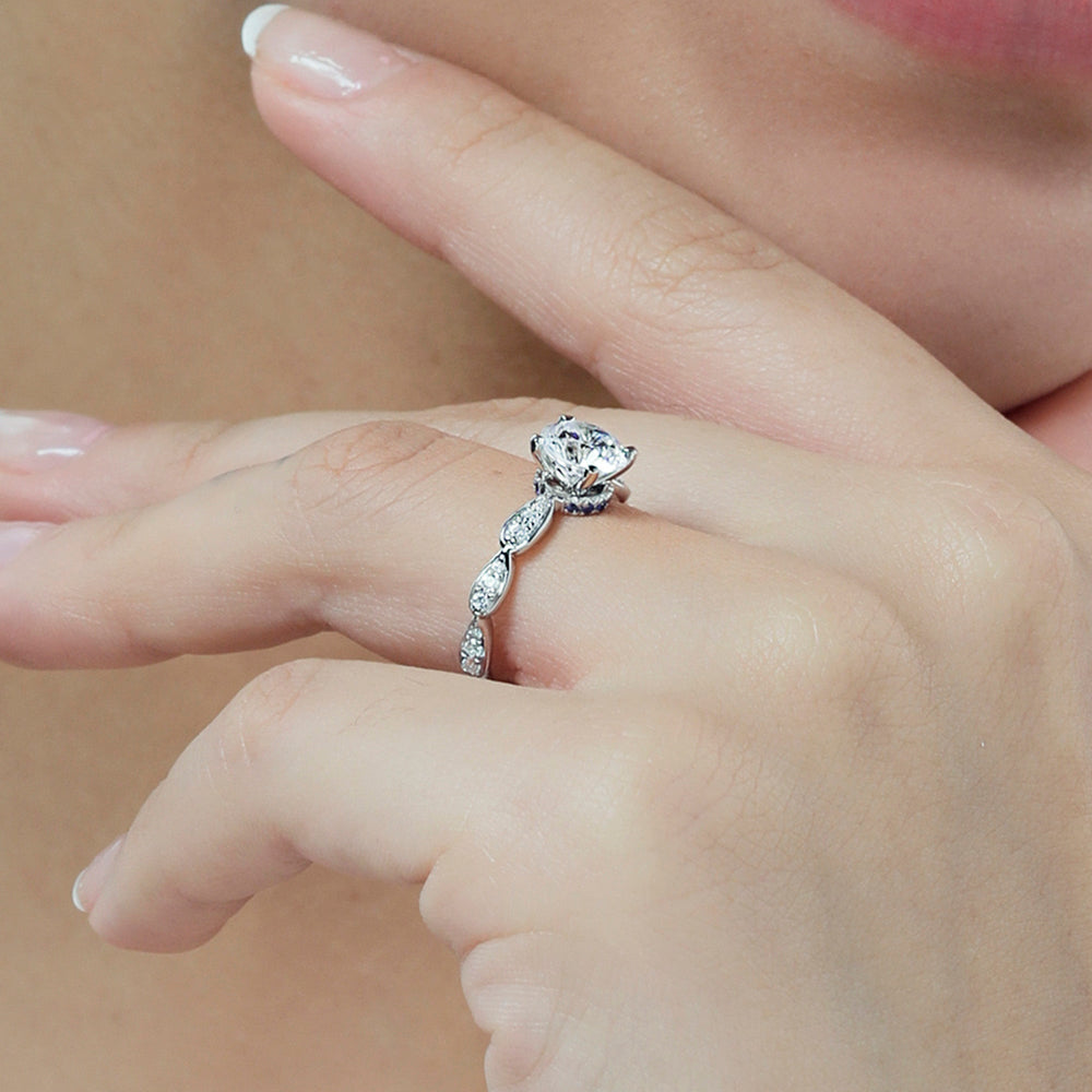 Model Wearing Something Blue Gerbera Under Halo Engagement Ring with Lab Grown Diamond view