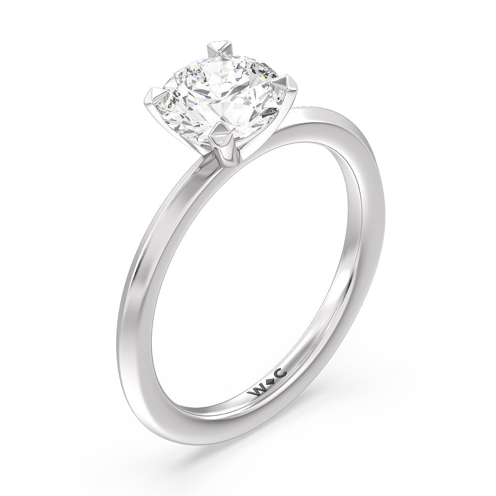 Petite Knife Edge Solitaire Engagement Ring with Round Cut Diamond in 14KT Platinum view 3
